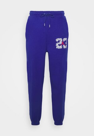 Paarse sweatpants van een katoenmix, met een elastische tailleband met trekkoord, open zijzakken en een grafisch ontwerp van "23" met accenten.