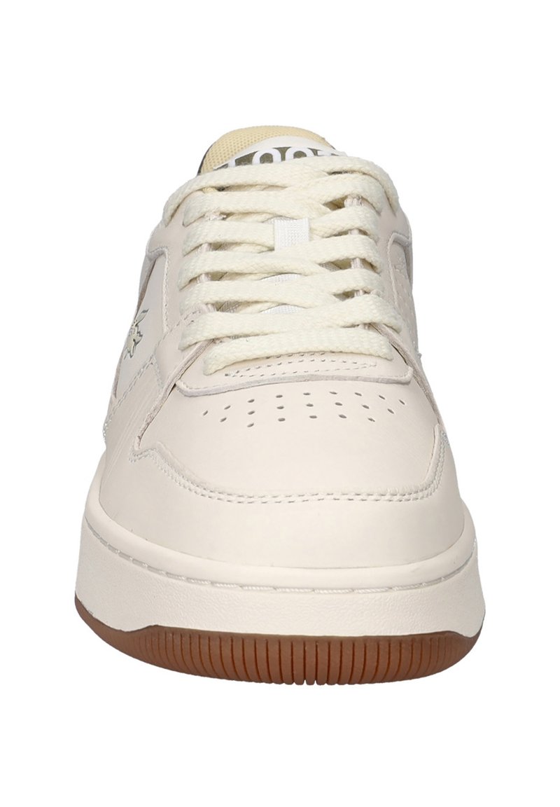 Lichtbeige sneaker met een gladleren bovenwerk, ronde neus, geperforeerde details en crèmekleurige veters. Voorzien van een rubberen zool van gom.