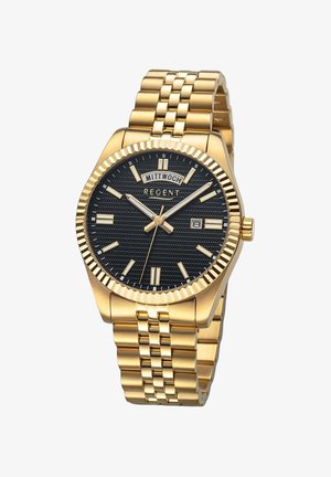 Montre dorée avec un cadran noir texturé, une fenêtre de date et des index; elle possède un bracelet à maillons et une lunette cannelée.