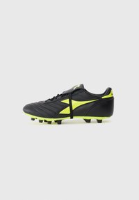 Black soccer cleat with bright yellow accents. Features a textured leather upper, lace closure, and multiple molded studs on the sole.