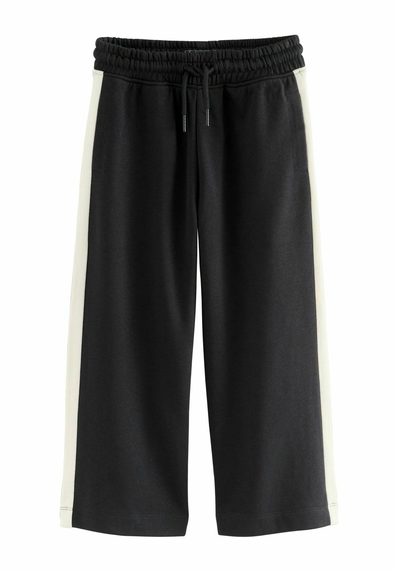 Black sweatpants with a white side accent, featuring an elastic waistband and drawstring. Made from soft, stretchy fabric.