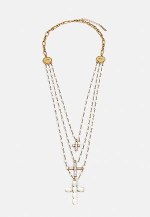 Gold-tone necklace with three chains, featuring two cross pendants adorned with white pearls and clear stones.