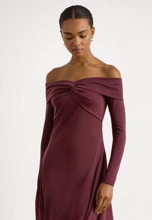 Burgundy off-the-shoulder dress with long sleeves, featuring a twisted bodice detail and smooth, stretchy fabric that drapes elegantly.