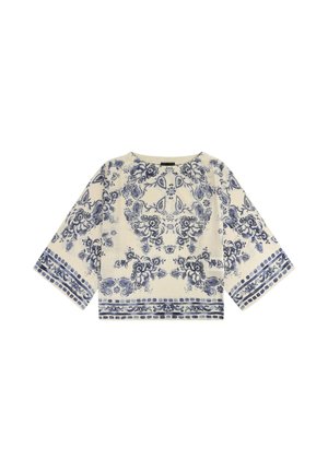 Blusa crema a maniche lunghe con ampie maniche e motivi intricati floreali e geometrici blu sul davanti, sulle maniche e sull'orlo.