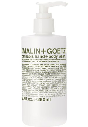 Clear plastic pump bottle filled with foaming hand and body wash. Label features green text against a white background, listing ingredients and directions.