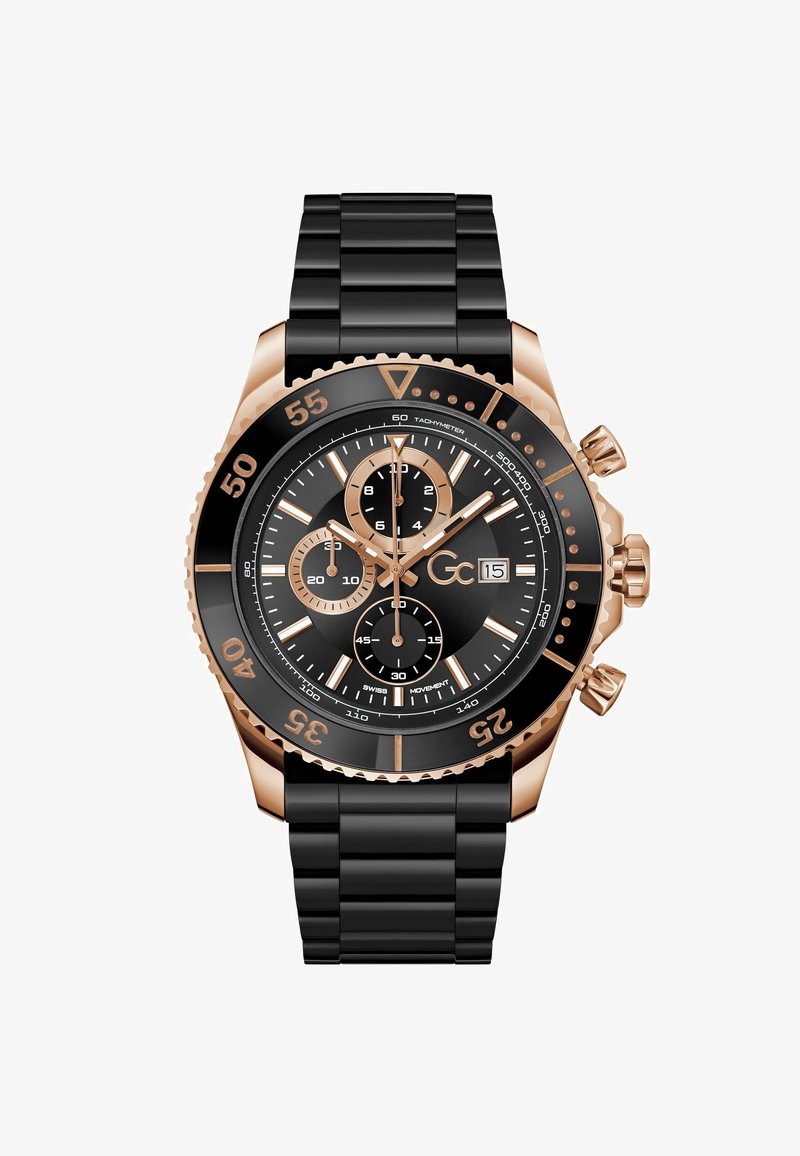 Reloj cronógrafo negro con correa negra de goma y detalles en oro rosa. Cuenta con una esfera negra, bisel taquimétrico y tres subesferas.