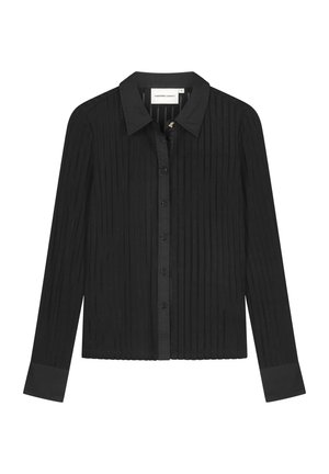 Zwart shirt met lange mouwen en een geribbelde textuur, knoopsluiting, klassieke kraag en contrasterende manchetten. Ontworpen met een aansluitend silhouet.