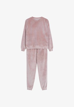 Zestaw dresowy z weluru w delikatnym różu, składający się z długiego rękawa z prążkowanymi mankietami oraz dopasowanych spodni na elastycznej talii z mankietami przy kostkach.