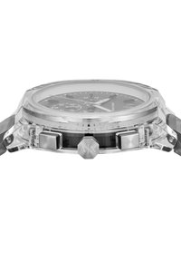 Montre en acrylique transparent avec un cadran noir, des accents argentés, des sous-cadrans chronographe et une couronne hexagonale portant le logo "AX".