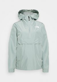 Light green waterproof jacket with a hood, half-zip front, and a front pocket. Features elastic cuffs and The North Face logo on the chest.