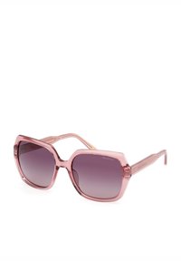 Gafas de sol polarizadas rosas con montura cuadrada, lentes ahumados degradados y patillas transparentes y elegantes. Detalles texturizados en la montura.