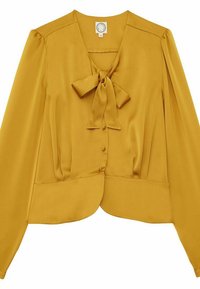 Blouse jaune moutarde en tissu lisse, avec un lien au cou, des manches bouffantes longues et un ourlet arrondi avec des détails de boutons.