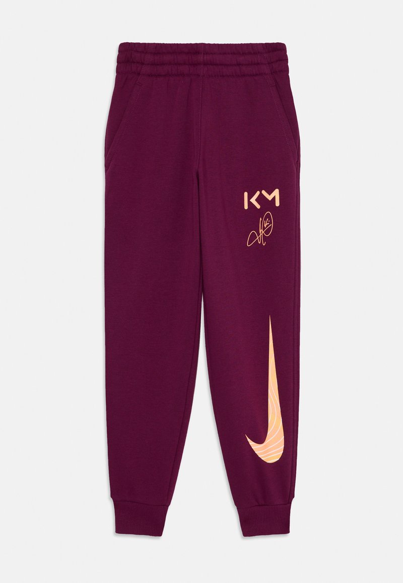 Bordo trenirke z elastičnim pasom, stranskimi žepi, zlatim logotipom "KM" in velikim oranžnim Nike swoosh dizajnom na levem hlačniku.