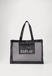 Black mesh tote bag with two sturdy handles, featuring a front pocket and "REPLAY" text in bold white font. Lightweight and transparent design.
