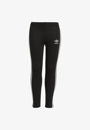 Leggings sportivi neri in tessuto elasticizzato, con strisce laterali bianche e un piccolo logo Adidas bianco sulla parte anteriore.