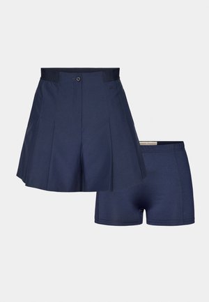 Navy pleated athletic skort with a button closure and attached shorts. Smooth fabric and stitching detail. Lightweight, designed for active use.