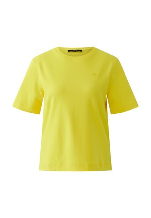 Yellow short-sleeve crew neck cotton T-shirt with a small heart logo on the left chest and a black brand label inside the collar.
