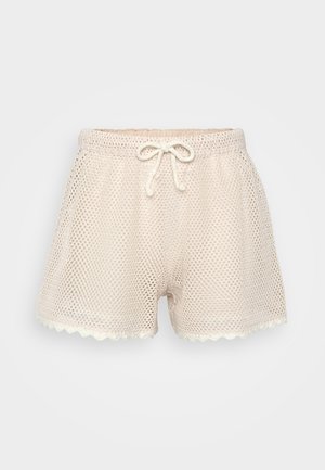 Mesh shorts in light beige with a textured, open weave. Features a drawstring waist and scalloped hem, offering breathable comfort.