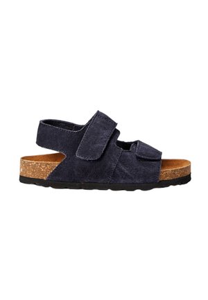 Sandales en daim bleu marine foncé avec deux sangles Velcro réglables, semelle en liège et semelle en caoutchouc noire. Conception ouverte, construction légère.