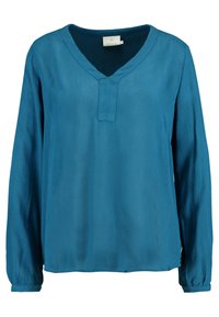Blouse à manches longues avec col en V, de couleur bleu sarcelle profond, fabriquée en tissu léger texturé, avec un détail subtil de patte de boutonnage et des manches à revers.