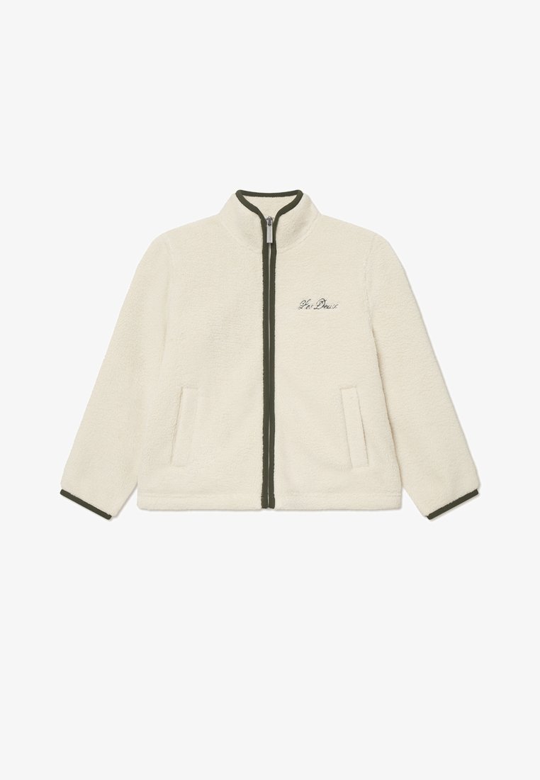 Džemperis ar rāvējslēdzēju krēmkrāsā ar augstu apkakli, tumši zaļiem akcentiem un divām priekšējām kabatām. Iekļauta izšūta apdruka uz krūtīm.