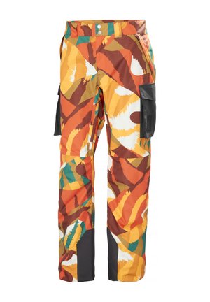 Pantalones de carga coloridos con un audaz patrón abstracto en naranja, amarillo, marrón y verde, con bolsillos y un acabado resistente al agua.