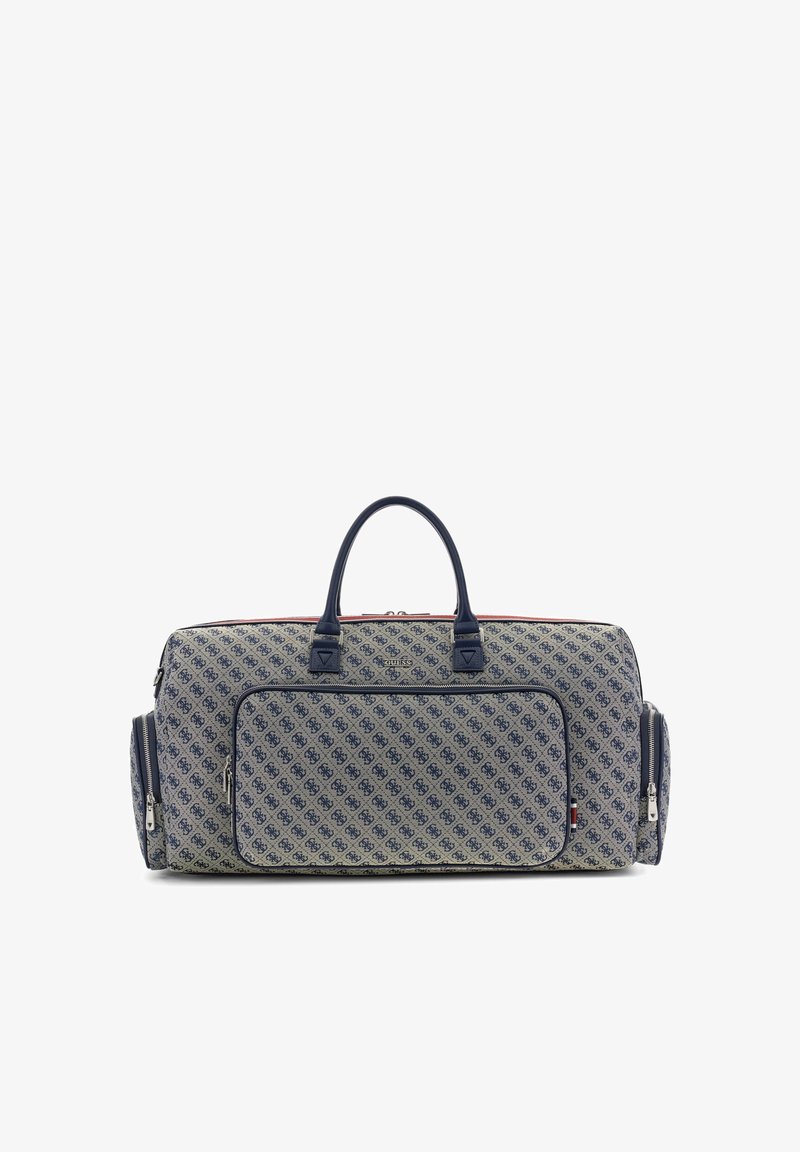 Grand sac de sport gris avec un imprimé de logo à motif bleu marine, deux poignées supérieures, une poche zippée frontale et des compartiments zippés latéraux.