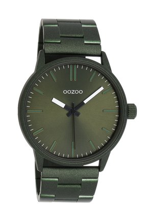 Green metal watch with a glossy finish, round face, minimalist white hour markers, and hands. Features a matching metal band with links.