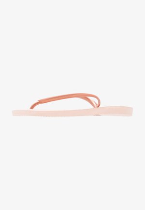 Pink rubber flip-flops with a textured footbed, thin straps, and a flat sole. The design features no patterns or additional accents.