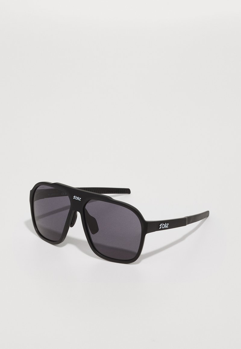 Black sunglasses with a wide rectangular frame, dark tinted lenses, and textured temples featuring a logo on the side. Matte finish.