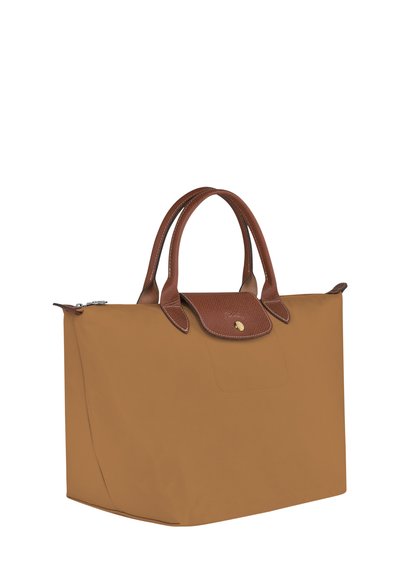 Brown nylon tote bag with leather accents, dual handles, and a top zip closure. Features a gold logo on the front and smooth texture.