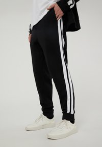 Terranova IN INTERLOCK CON BANDE - Pantaloni sportivi - nero