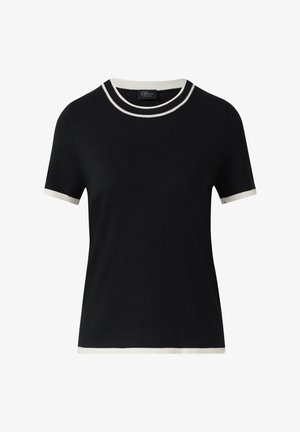 Mustmustar värvi lühikeste varrukatega kootud särk, millel on valge ääris kaeluses, varrukaotstes ja allääres. Särgil on ümar kaelus ja kaeluses on väike brändi silt.