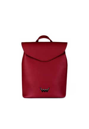 Red faux leather backpack with a fold-over flap and a top handle. Features a black logo accent at the bottom. Smooth texture throughout.