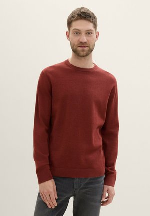 Maroon knit sweater with long sleeves, round neckline, and ribbed cuffs. Smooth texture, simple design, suitable for casual wear.