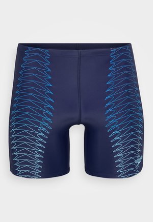 Marina simbyxor med geometriskt blått zigzag-mönster som löper vertikalt på båda sidor. Tillverkade av stretchmaterial och har en åtsittande design.