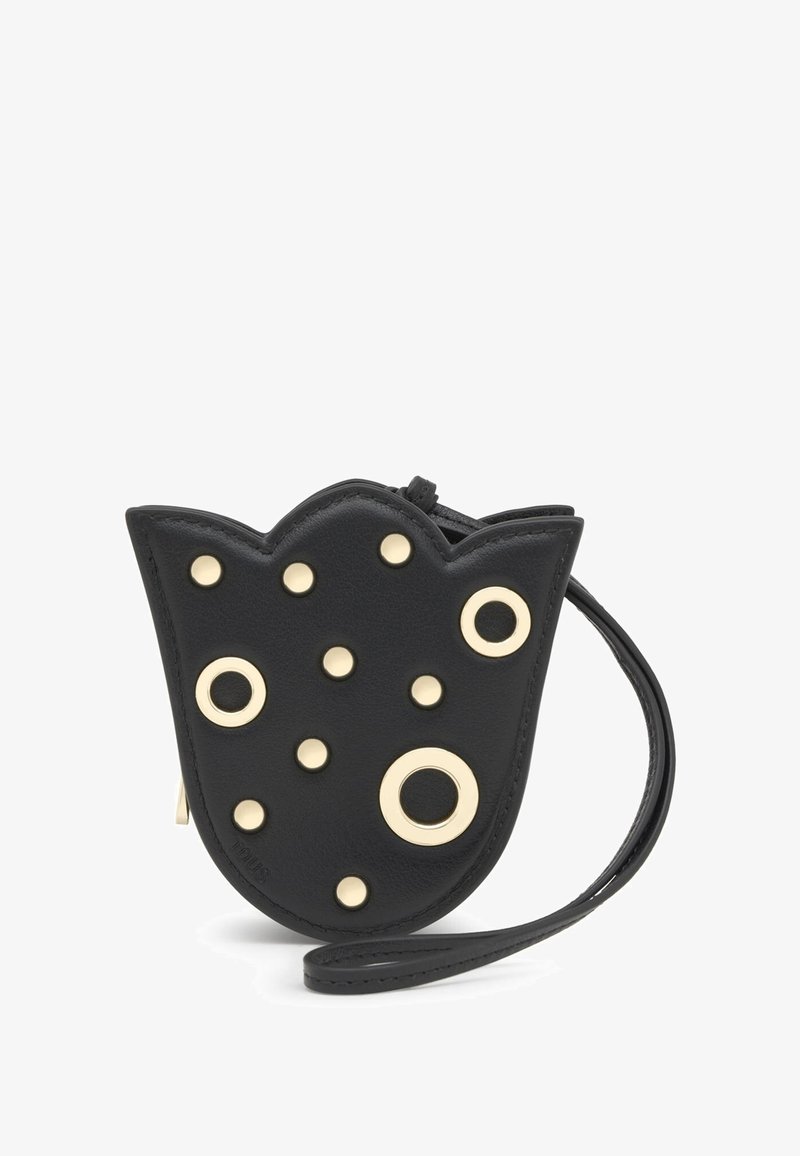 Czarny skórzany pokrowiec w kształcie tulipana, z ozdobami ze złotego metalu, okrągłymi ćwiekami oraz paskiem na nadgarstek. Gładka faktura z falistymi krawędziami.