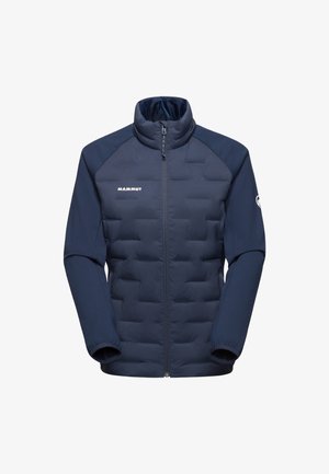 Mörkblå jacka med en vadderad body i quiltat tyg och släta ärmar, hög krage, framzipper och logotypen "MAMMUT" på bröstet.