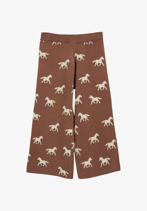 Bruine gebreide broek met wijde pijpen met een herhaald patroon van witte paarden silhouetten over de hele stof.
