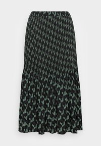 Středně dlouhá sukně v černé a zelené barvě s geometrickým vzorem kostek, smocked pasem a vrstveným designem pro zvýšení textury.