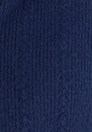 Tessuto a maglia di un profondo blu navy, con un motivo a coste testurizzato. Il materiale appare morbido e leggermente peloso, con fibre visibili.