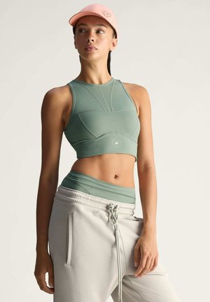 TRAINING CROP - Medium support sports bra - stone green