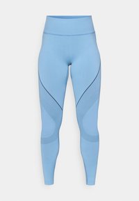 Világoskék leggings, rugalmas anyagból, magas derékkal, ívelt varrásokkal és texturált diagonális mintákkal az oldalán.