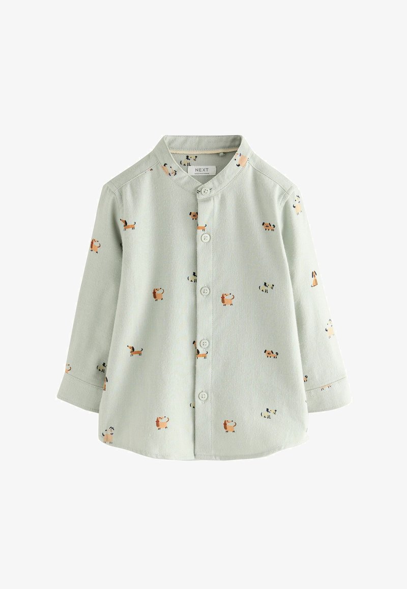 Maglietta verde chiaro per bambini con maniche lunghe, colletto tondo, bottoni frontali e piccoli cani stampati in vari colori.