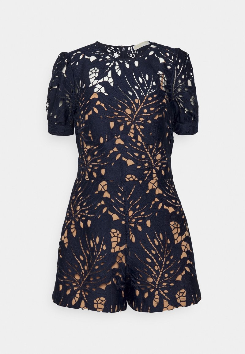 Combinaison courte manches courtes en dentelle marine avec motif floral ajouré et doublure beige, dotée d'un col rond et d'une coupe ajustée.