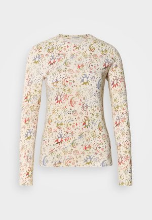 Koszula z długim rękawem w jasnobeżowym kolorze, wykonana z bawełny, ozdobiona kolorowym, niebiańskim wzorem z gwiazdami, księżycami i motywami kwiatowymi. Gładka tekstura.