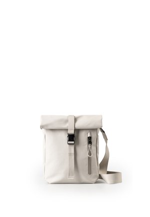 Light gray roll-top shoulder bag with front vertical zipper pocket and adjustable strap on white background.