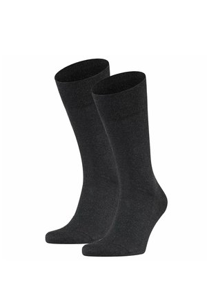 Paar schlichter schwarzer Knöchelsocken, aufrecht stehend mit glatter Textur und ohne sichtbare Muster oder Logos.