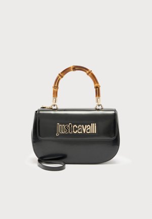 Black leather handbag with bamboo handle and gold "Just Cavalli" logo on front flap, featuring a detachable shoulder strap.