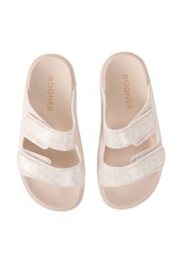 Light beige slide sandals with Velcro straps, featuring a textured upper and embossed logo pattern. Soft footbed for comfort.